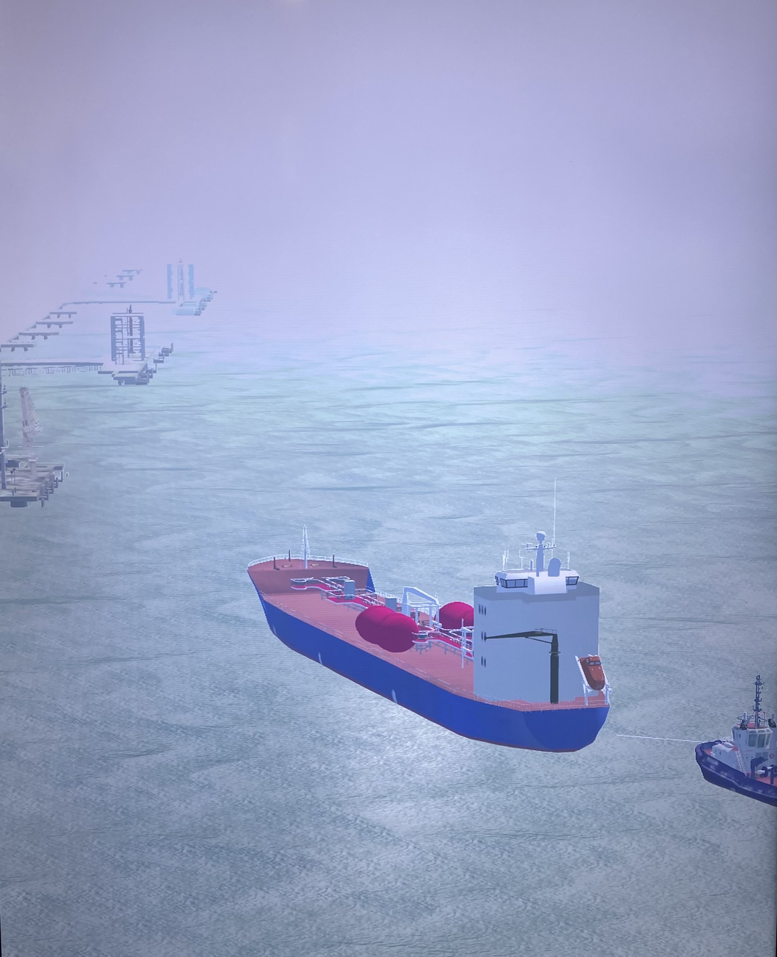 Simulated tanker and tug in restricted visibility