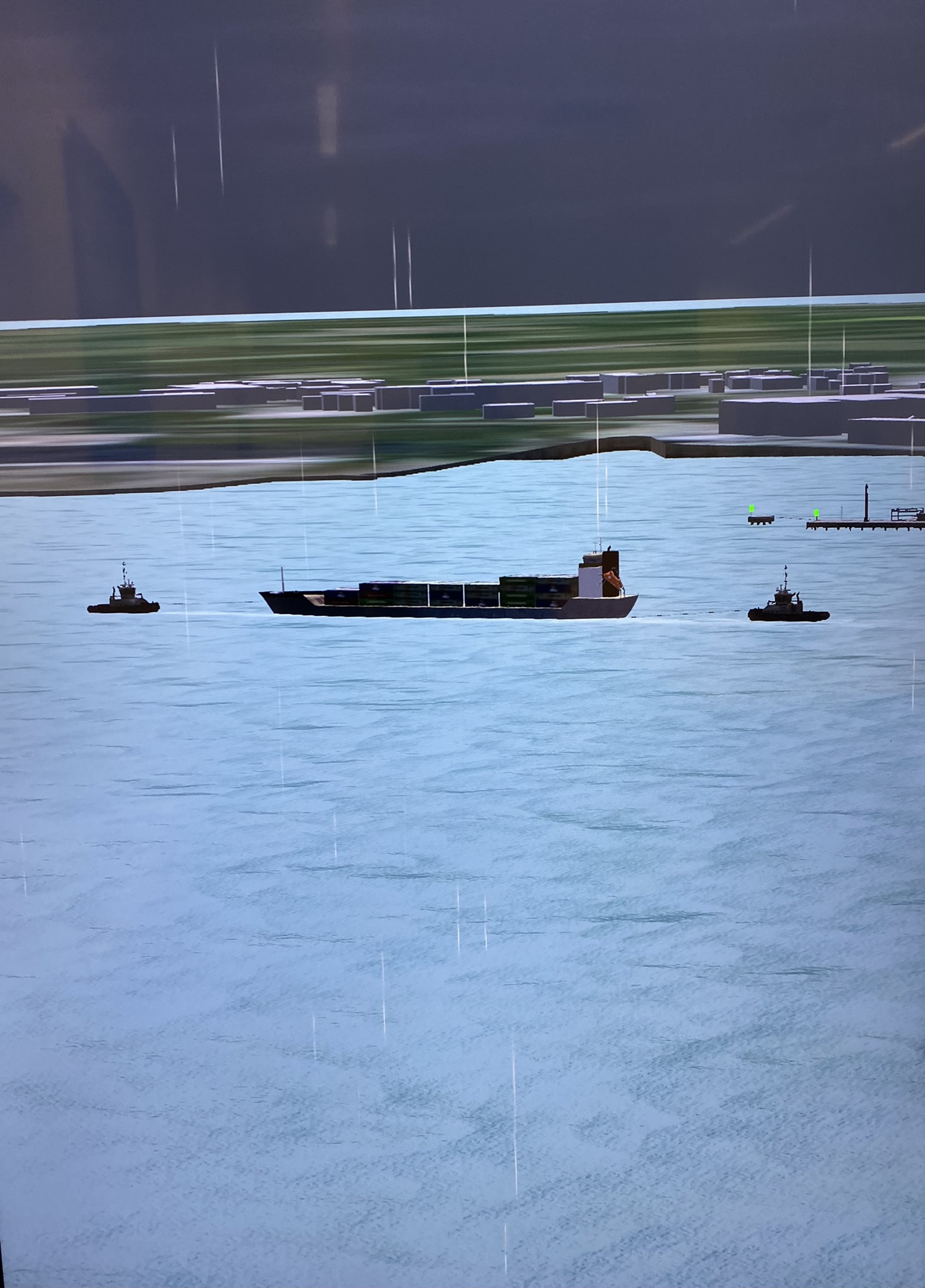 Simulated container vessel with two tugs